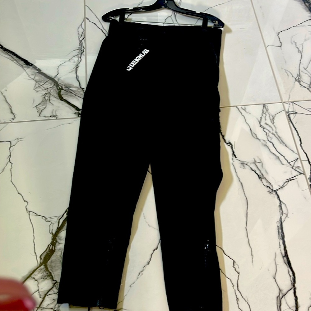 very unique, designer pants with zippers the pockets, bottom front legs size sm
